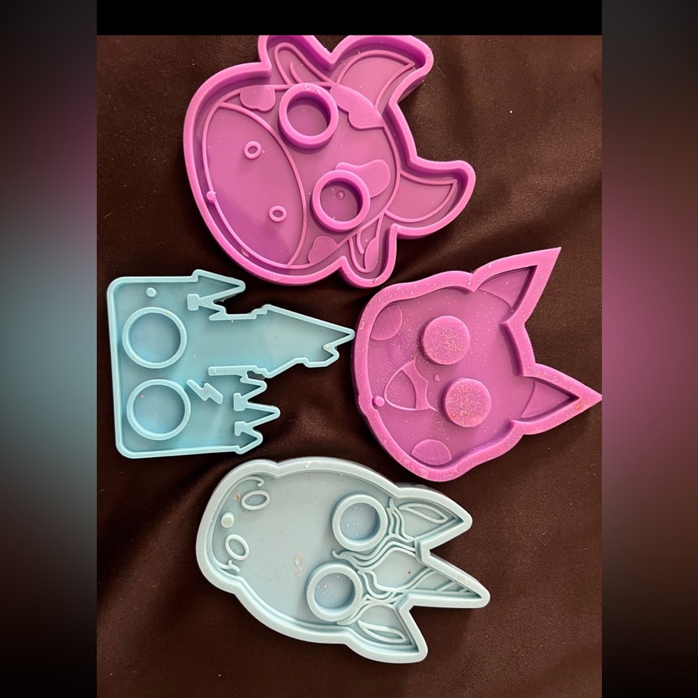 Set of 4! 
•1 Pikachu
•1 cow 
•1 unicorn 
•1 Harry Potter house ￼
Lightly used